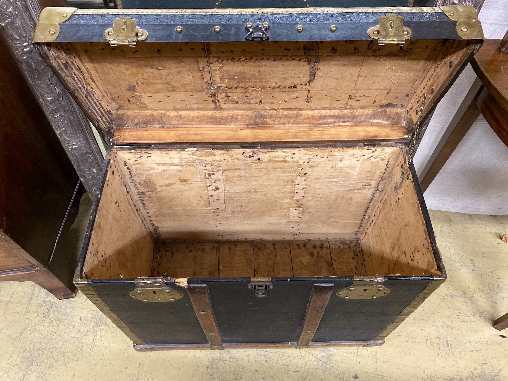 A Victorian brass and oak mounted black leather travelling trunk, length 75cm, depth 36cm, height 62cm